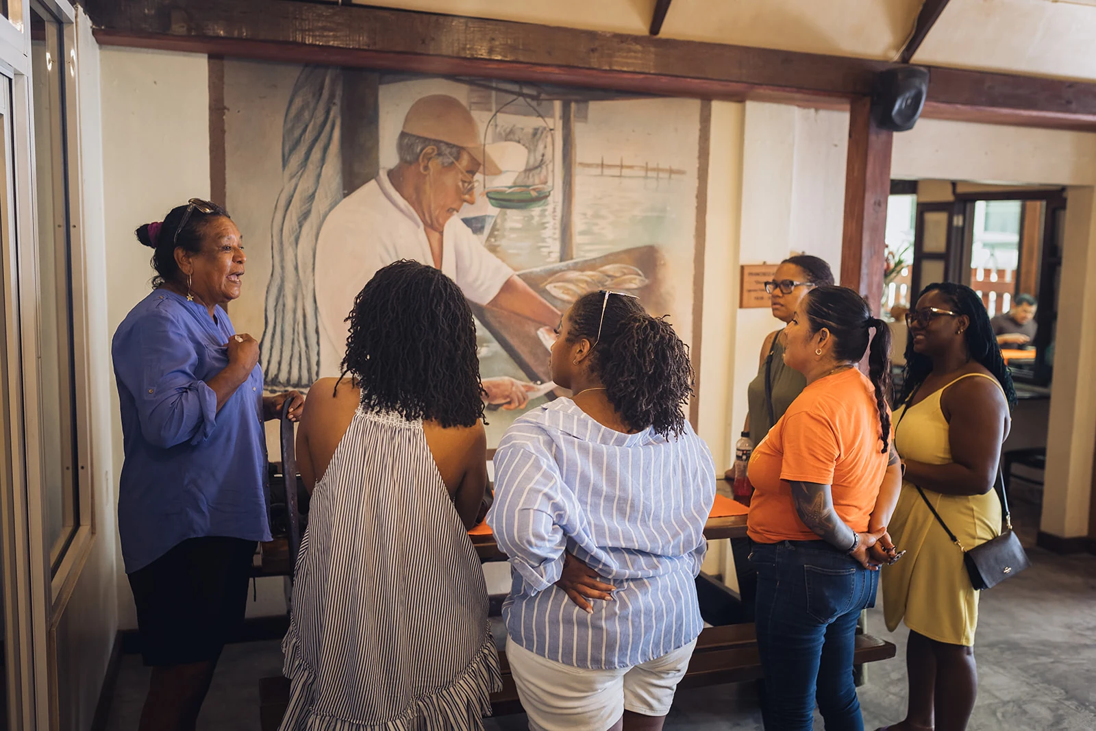 Guide sharing island food stories with guests at El Fogon